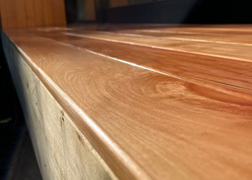 Close-up of a wooden surface with a blurred background