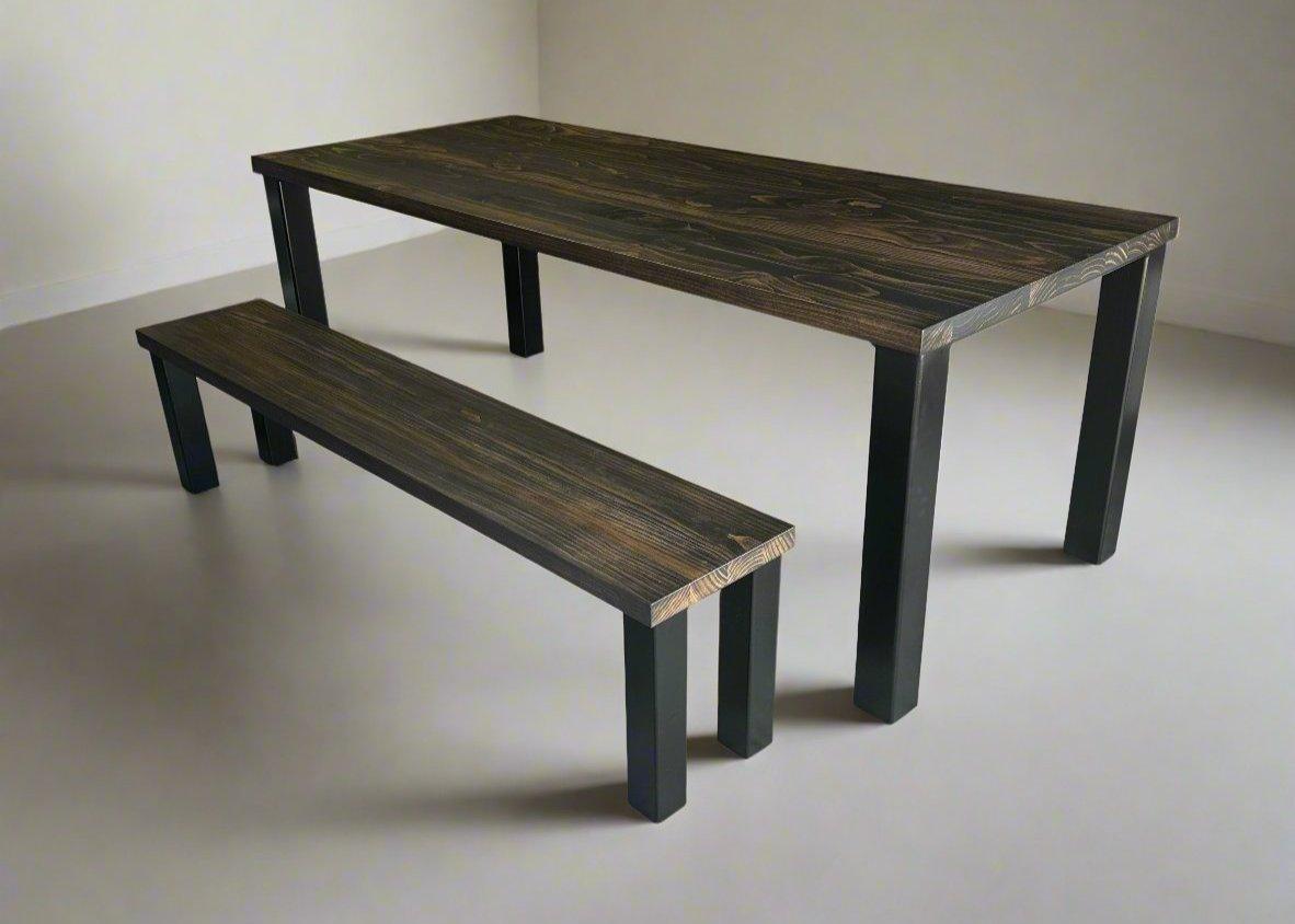A rectangular dining table with a simple, modern design featuring straight solid wood legs flush with the ends of the table top, shown in a stylish dining area with minimalist décor.