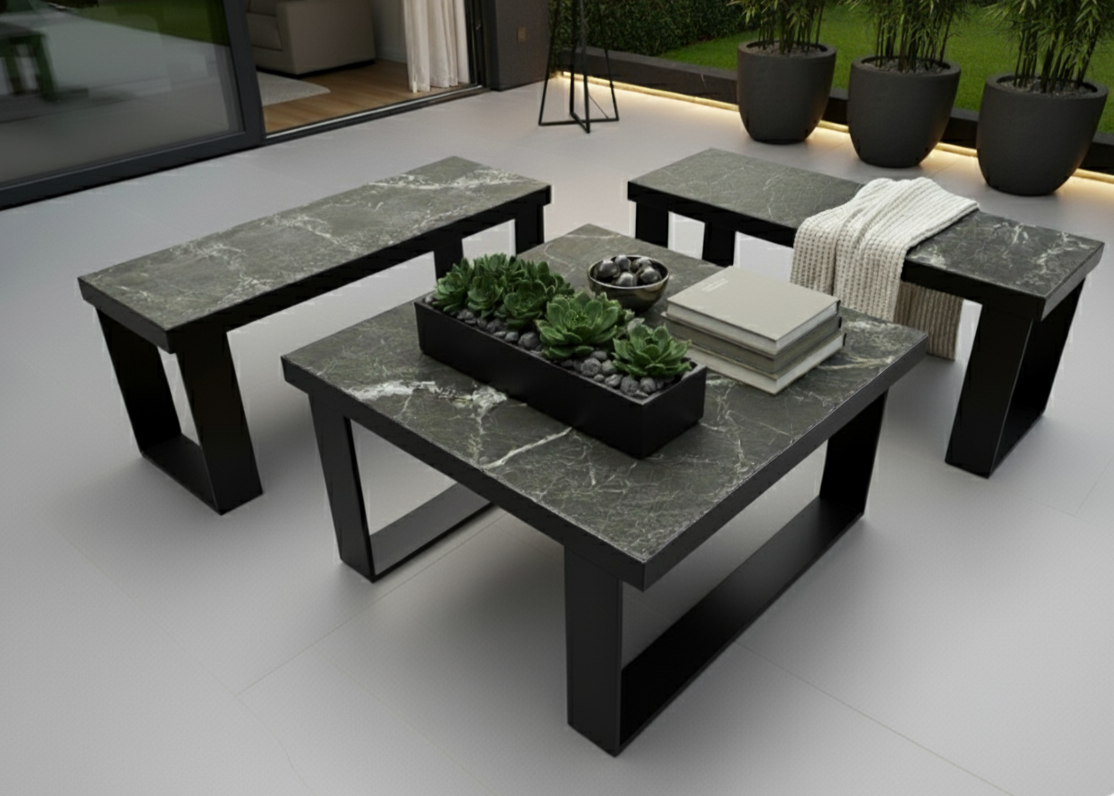 Outdoor furniture set with marble-like tables and benches on a patio.