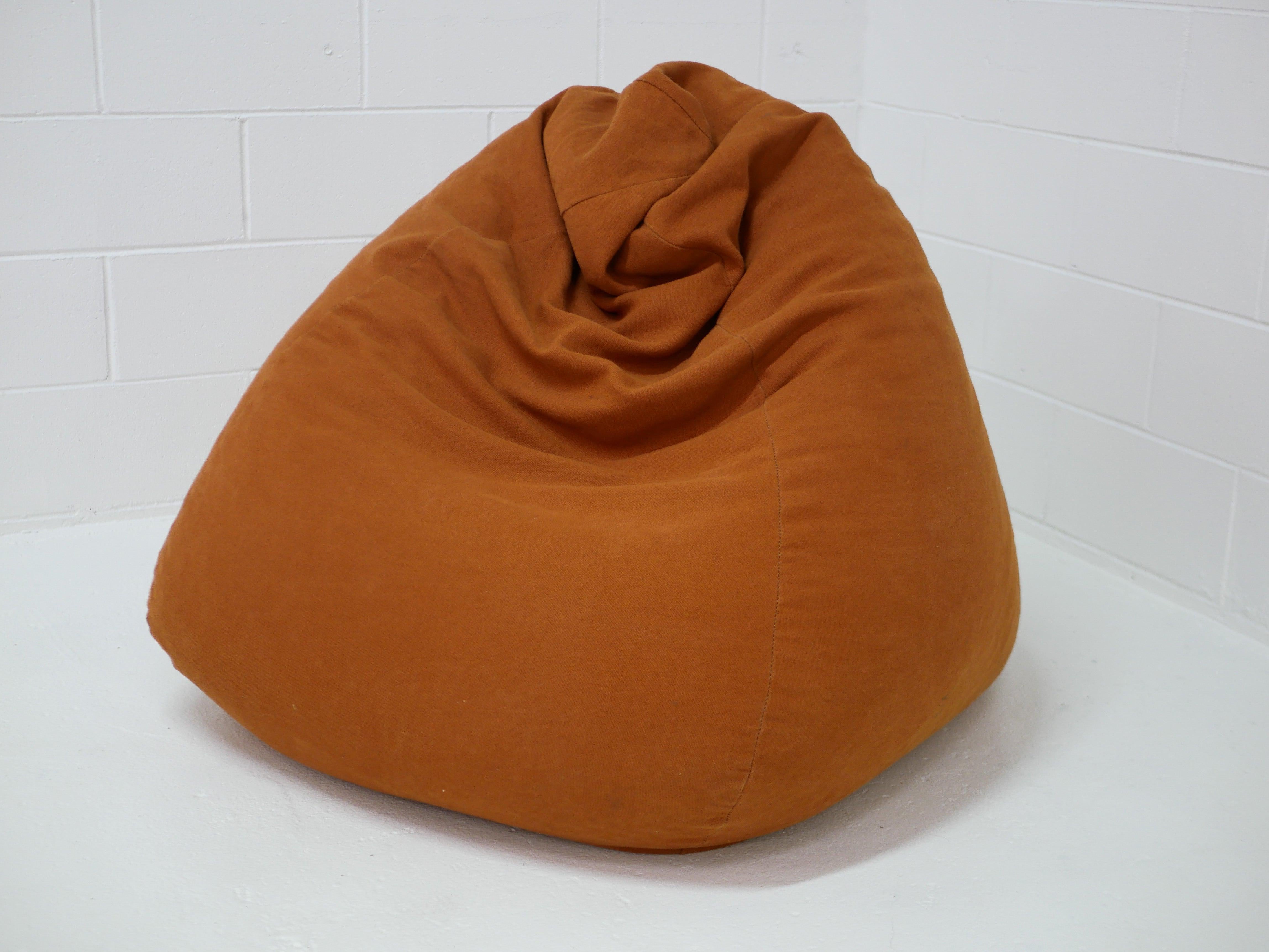 Rust orange hemp canvas bean bag handcrafted by Innate Furniture, shown in a minimal white studio setting.