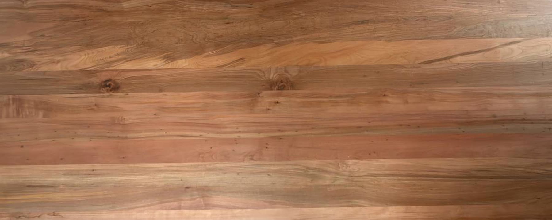 West Coast beech tabletop showing natural grain, knots and warm colour variation
