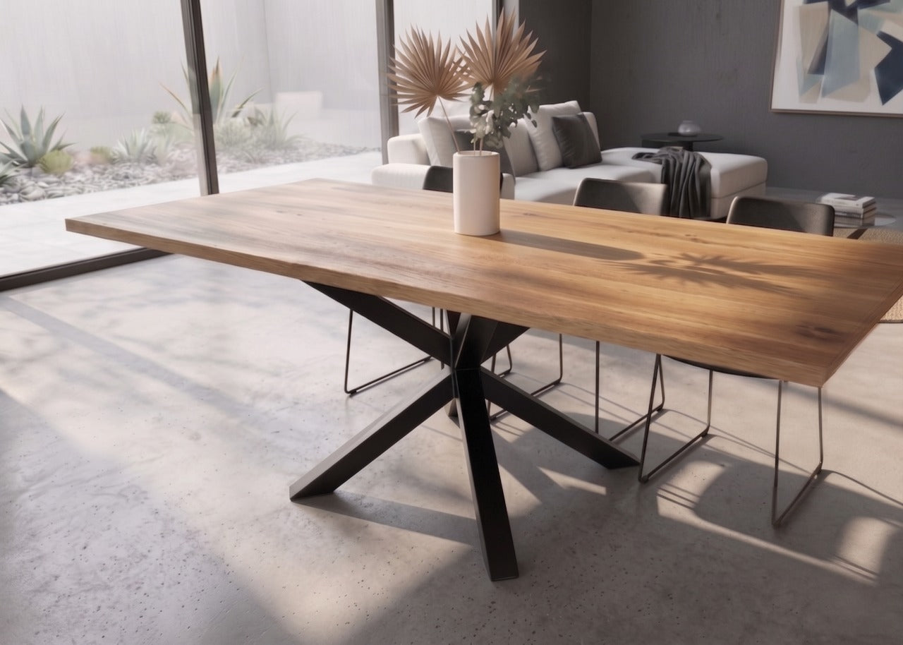 Steel Asterix dining table in warm solid NZ native timber with asterisk-shaped powder-coated steel base, Christchurch-made