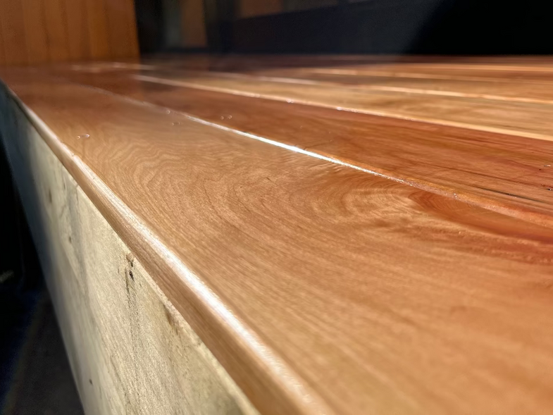 Close-up of a wooden surface with a blurred background