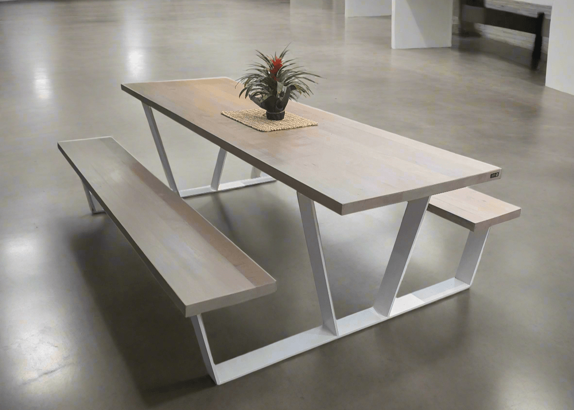Light wood-tone dining table shown with a matching benches and white frame