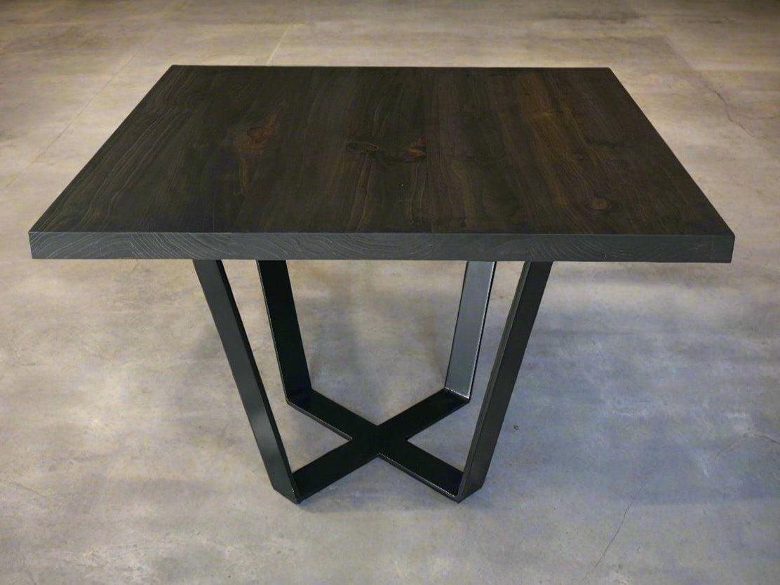 Square side table with dark top and black geometric base