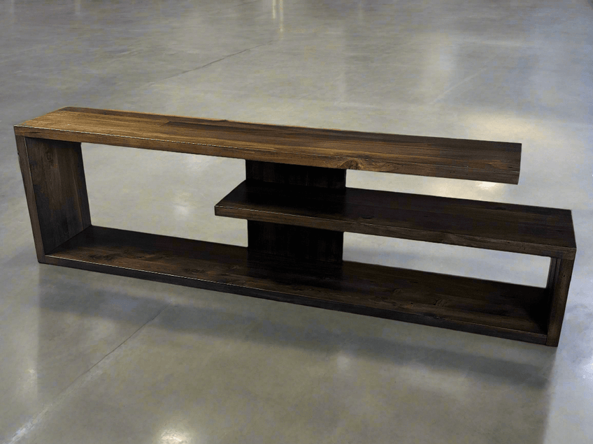 Dark low entertainment unit with open rectangular frame on a polished floor