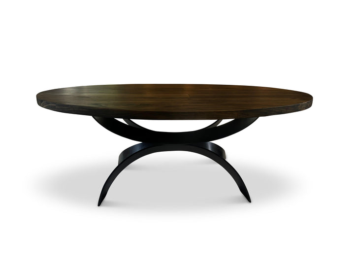 Round dark coffee table with sculptural curved black base