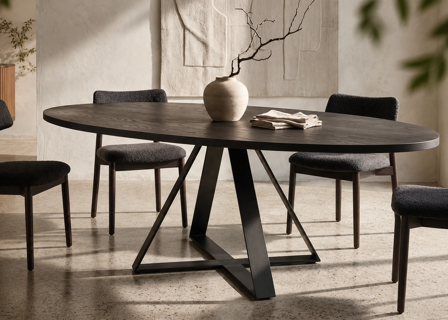 Oval Crossroads dining table with solid NZ native timber top and black steel base