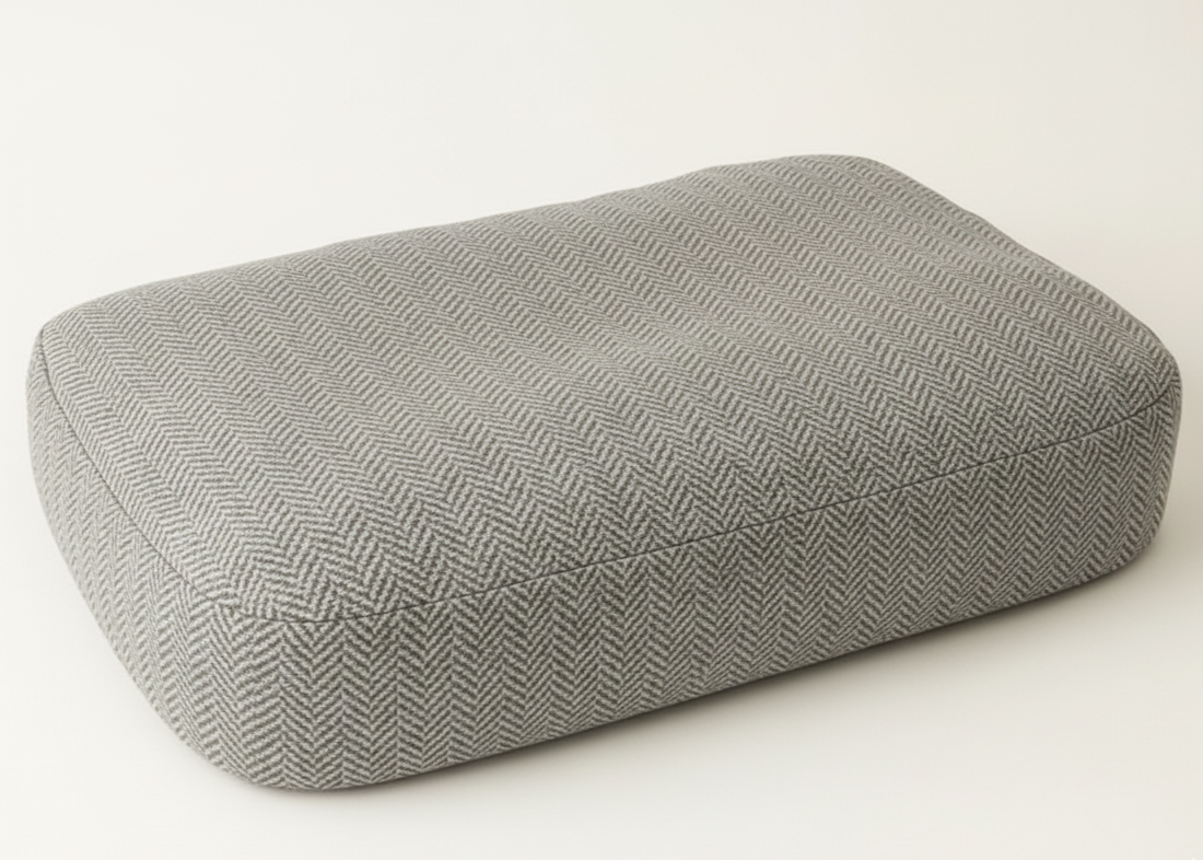 Gray textured rectangular cushion on a white background