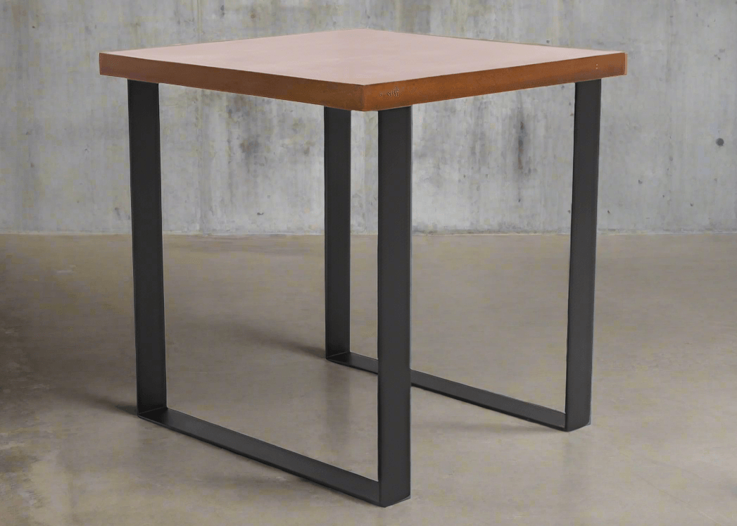 Square table with brown top and black loop legs on grey floor