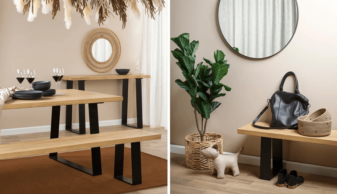 A handcrafted solid wood dining table with black powder-coated steel angled legs, shown with a matching wood bench in a contemporary dining room.