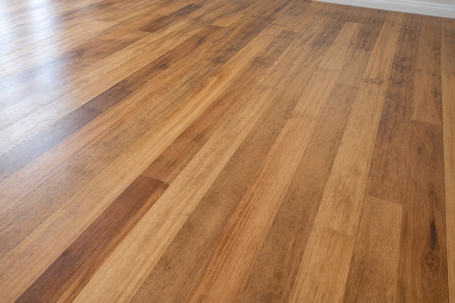 Natural grade beech flooring, 85 x 19 mm boards laid with a clear oil finish