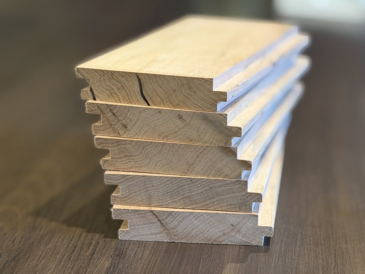 Uncoated beech tongue and groove floorboards showing the 19 mm profile