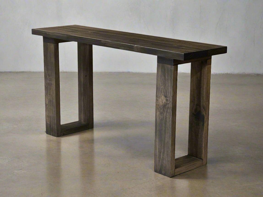 Narrow console table with dark wood-grain top and two rectangular leg frames