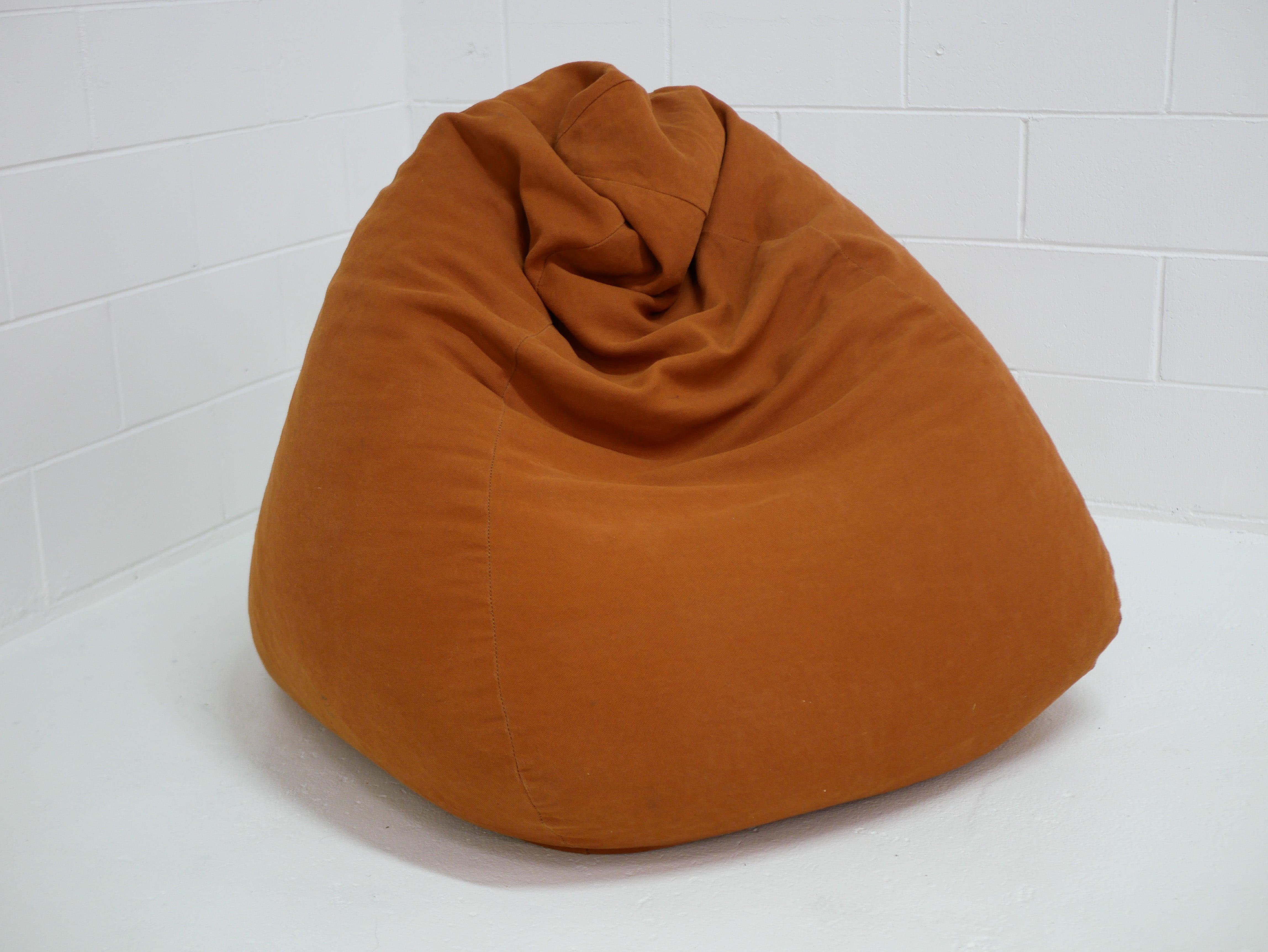 Rust orange hemp canvas bean bag handcrafted by Innate Furniture, shown in a minimal white studio setting.