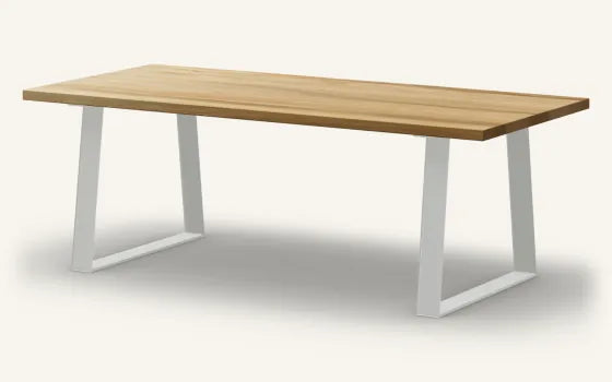 Render of a rectangular Rimu dining table, Natural finish, on the Incline base in Appliance White steel